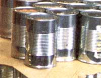 Food banks receive pallets of "brights"—cans with no labels. Volunteers sort and label them by code number.